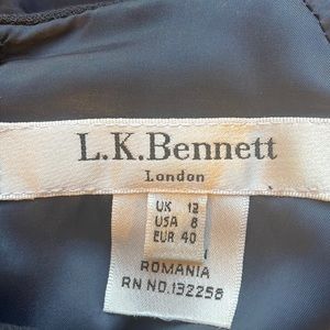 Navy cap sleeve work to dinner dress for timeless style; dry clean only